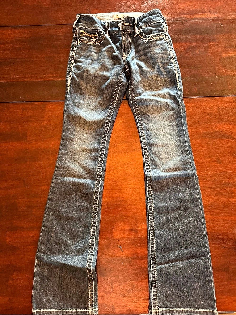 Ariat R.E.A.L. Mid-Rise Entwined Festival Boot Cut Jeans. Entwined Jeans Blue